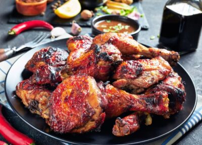 A vibrant photo of jerk chicken with rice and peas a